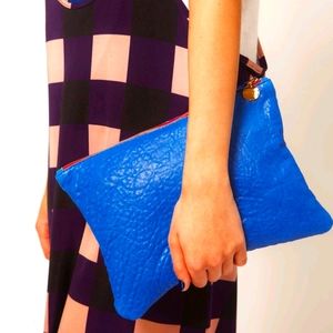 Editorial Clare Vivier indigo blue leather foldover clutch